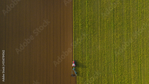 Drone photo of tractor ploughing field, Great Wilbraham; Cambridgeshire, England, United Kingdom