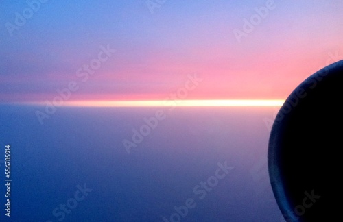 sunset over the sea flight horizon