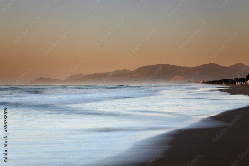Sunrise on the western beach at Sperlonga, Lazio, Italy.; Sperlonga, Mediterranean Sea, Lazio province, Italy. Sunrise on the western beach at Sperlonga, Lazio, Italy.; Sperlonga, Mediterranean Sea, Lazio province, Italy.