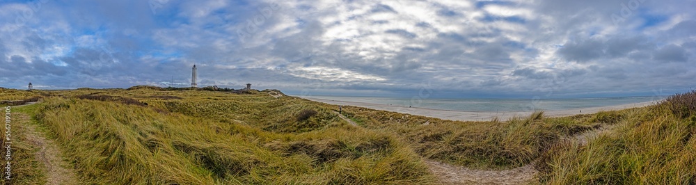 Panoramic picture over the beach and lighthouse of the Danish coastal town Balavand during the day Panoramic picture over the beach and lighthouse of the Danish coastal town Balavand during the day