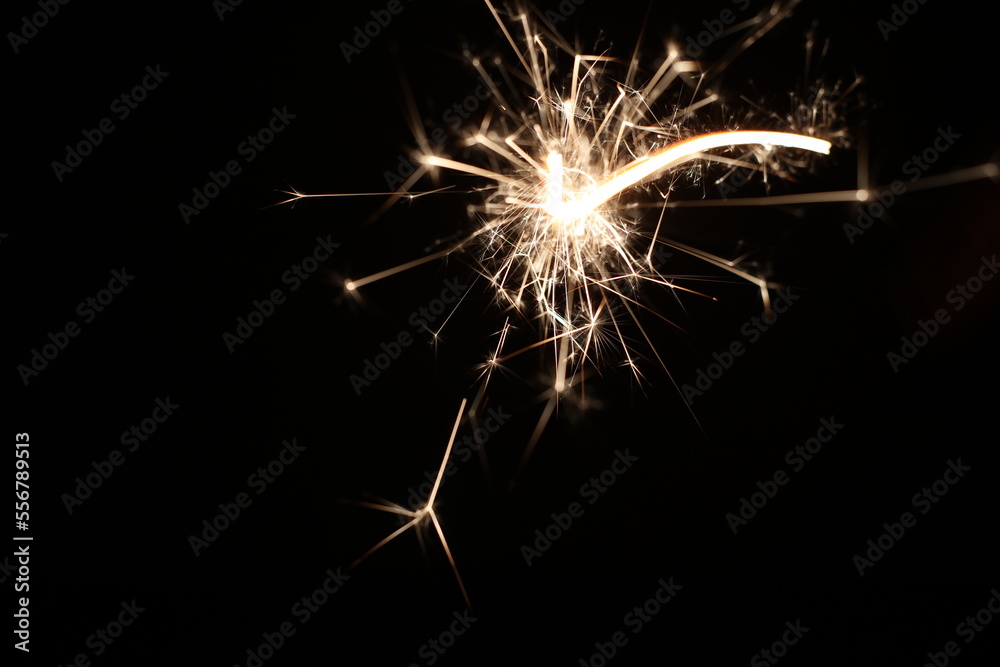 sparkler on black firework flame