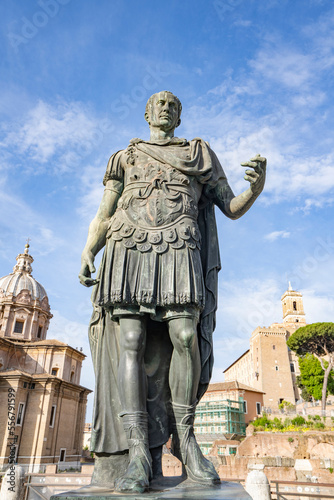 Close-up of Statua di Cesare (Statue of Julius Caesar) in front of Chiesa Santi Luca E Martina and Foro Romano ruins (Roman Forum) of Ancient Rome; Rome, Italy