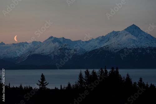 Moonrise over Kachemak Bay and the Kenai Mountains, Alaska, USA; Homer, Alaska, United States of America photo