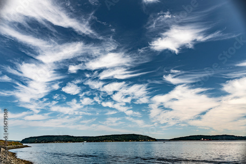 Cirrus Coulds above and Vashon Island below across Commencement Bay, Puget Sound; Tacoma, Washington, United States of America photo