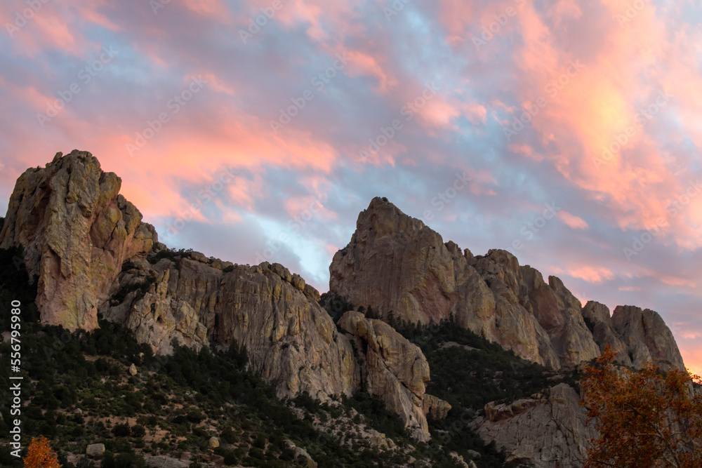 Sunset clouds above the rugged cliffs of Cave Creek Canyon in the Chiricahua Mountains of Southeast Arizona; Portal, Arizona, United States of America Sunset clouds above the rugged cliffs of Cave Creek Canyon in the Chiricahua Mountains of Southeast Arizona; Portal, Arizona, United States of America