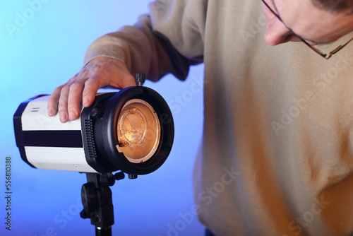 studio lamp without modifier with a bare burner with a person photo