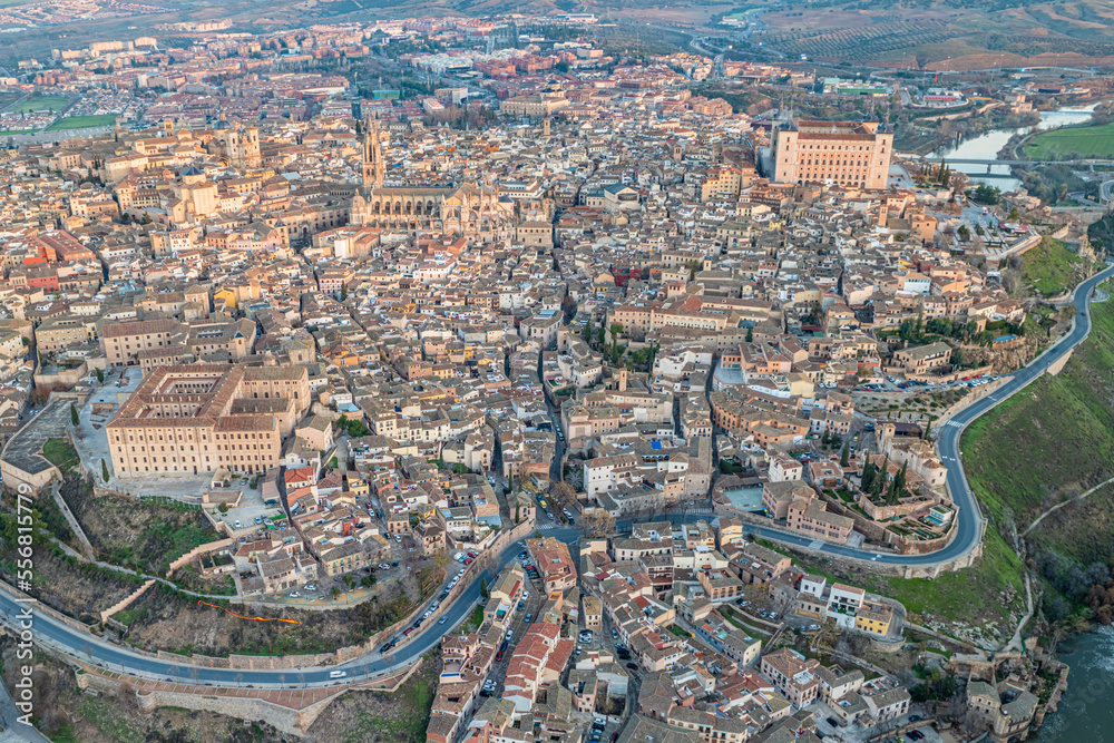 Aerial views of the city of Toledo during a sunrise on a clear and sunny day