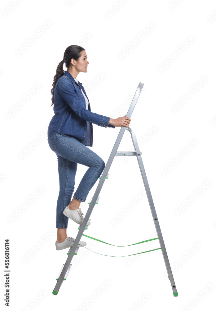 Young woman climbing up metal ladder on white background Young woman climbing up metal ladder on white background