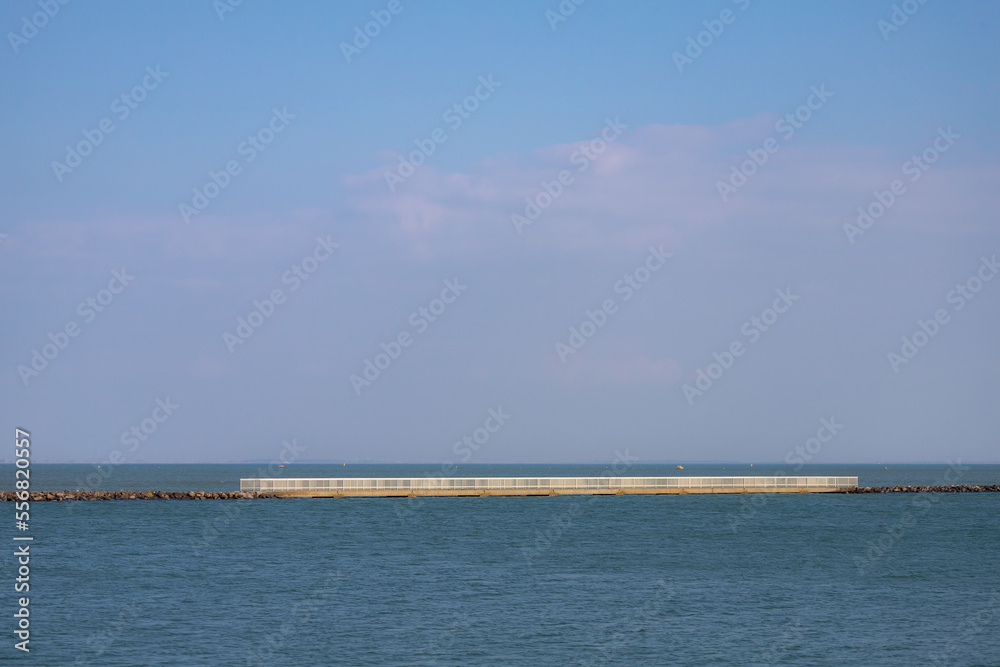 White iron bridge crossing between islands in Neeltje Jans, Small island in the province of Zeeland, The Delta Works is a projects to protect land around the sea, Flood protection system, Netherlands.