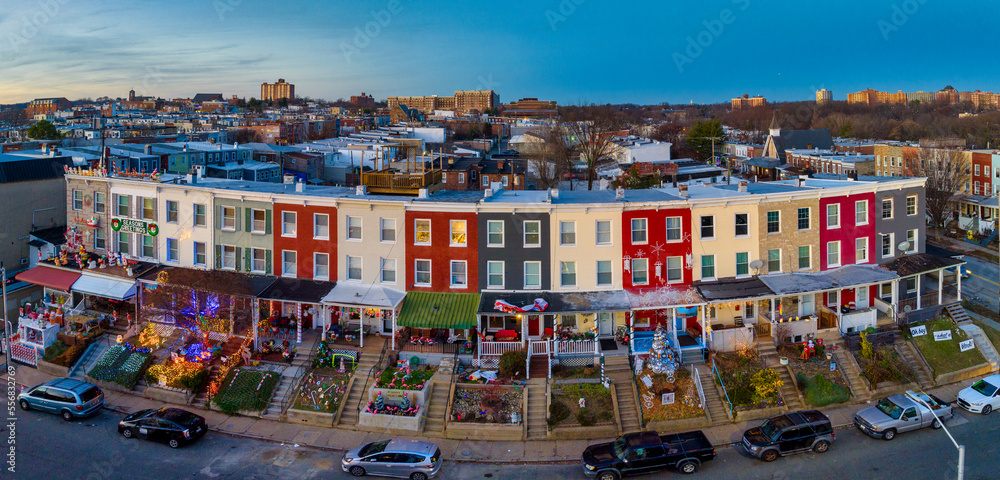 Famous holiday Christmas light block on 34th street in Baltimore with colorful row houses, lights and decoration before sunset