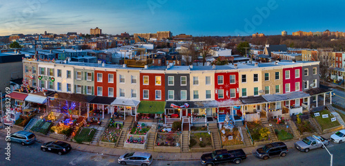 Famous holiday Christmas light block on 34th street in Baltimore with colorful row houses, lights and decoration before sunset