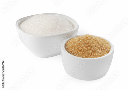 Bowls with different granulated sugar on white background