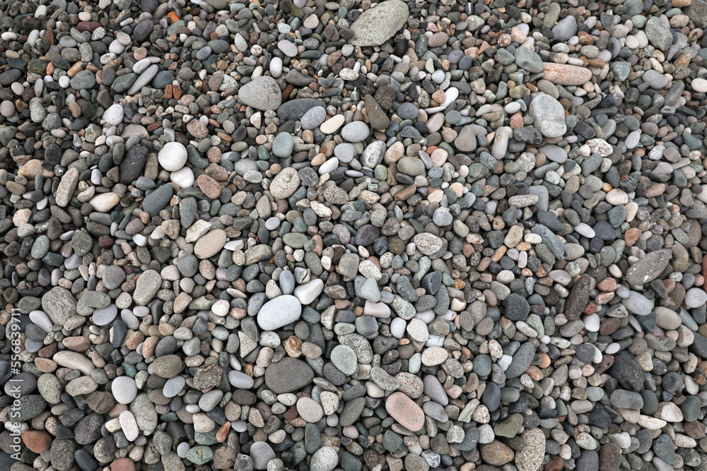Many different pebbles as background, top view Many different pebbles as background, top view