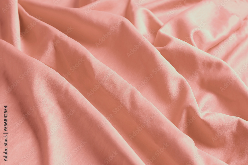 Pink shiny fabric as background, closeup view Pink shiny fabric as background, closeup view