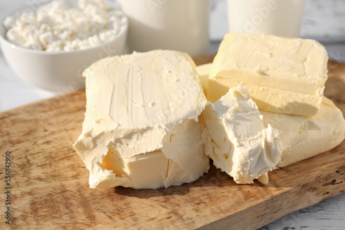 Tasty homemade butter and dairy products on white wooden table, closeup