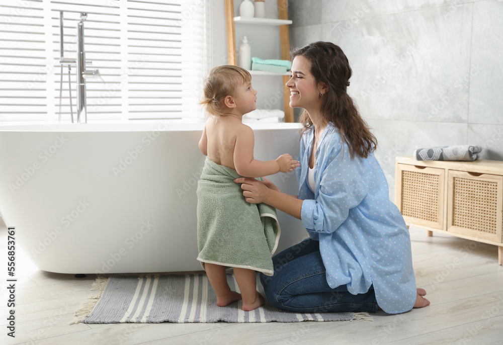 Mother with her daughter after bath at home Mother with her daughter after bath at home