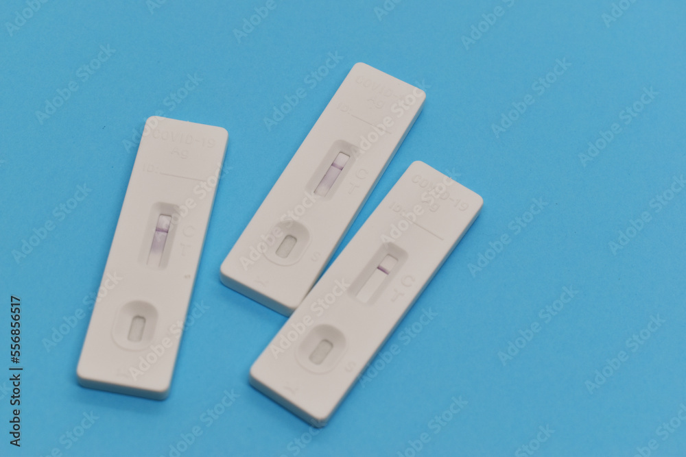 covid test kit on blue background covid test kit on blue background