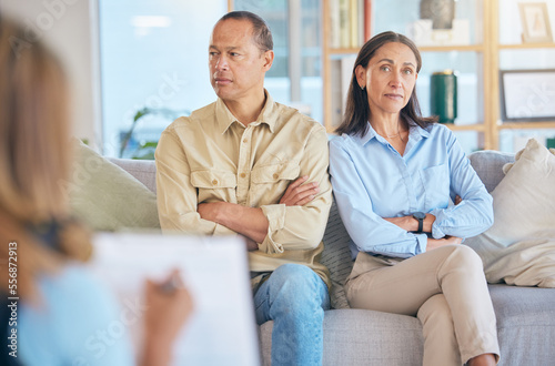 Divorce, therapy and couple consulting therapist for failed marriage. Counseling, consultation and portrait of angry and sad man and woman talking with psychologist for help to save relationship.