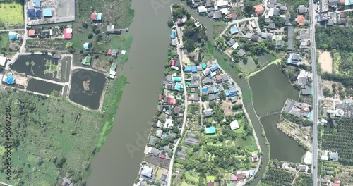 flying with blue sky day time view above little conutry side city with pollution and storm so far on horizon photo