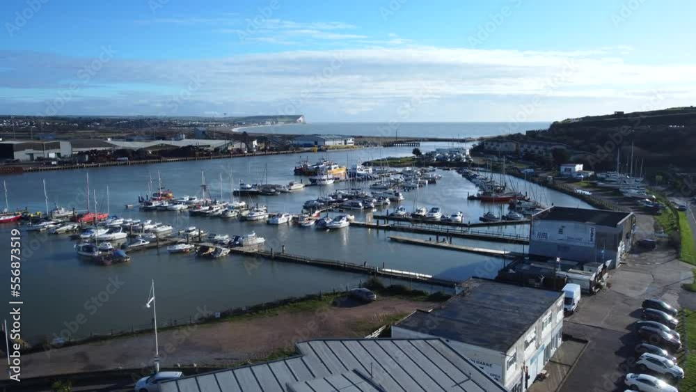 Long and slow drone shot flying over marina and port on coast of UK Long and slow drone shot flying over marina and port on coast of UK