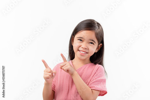 Portrait Of Cute Girl asia With Long Hair Gesturing pointing finger While Standing Against White Background
