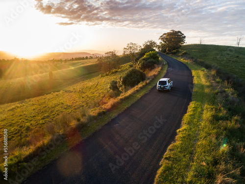 Four wheel drive car on narrow country road in Australia showing concept of travel insurance