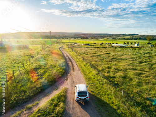 Four wheel drive car on country road trip driving on gravel road - Hope and adventure concept