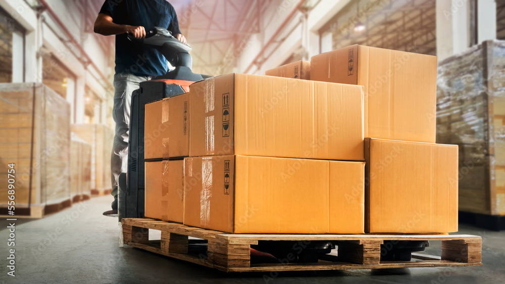 Workers Unloading Packaging Boxes on Pallet in Warehouse. Electric Forklift Loader. Cartons Cardboard Boxes. Supplies Shipping Warehouse. Supply Chain Shipment Goods. Distribution Warehouse Logistics	 - obrazy, fototapety, plakaty 