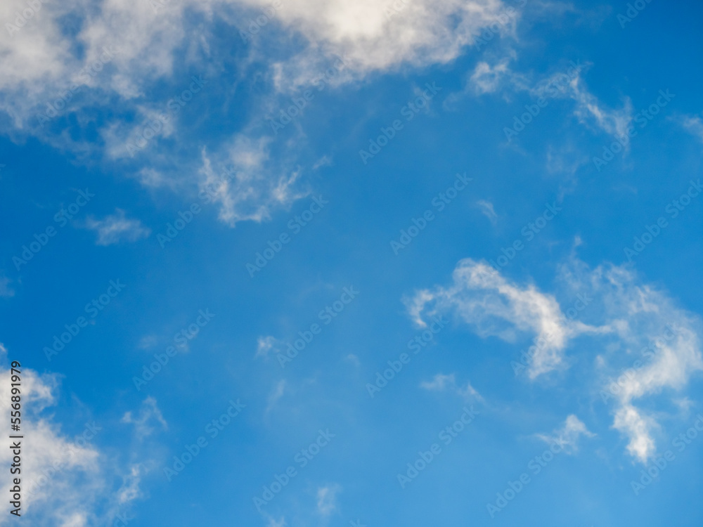Light soft clouds against a bright blue sky Light soft clouds against a bright blue sky