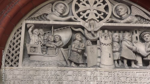 The Tympanum on The French Protestant Church Of London, Soho Square, King Edward VI signing the Royal character in 1550, 4k photo