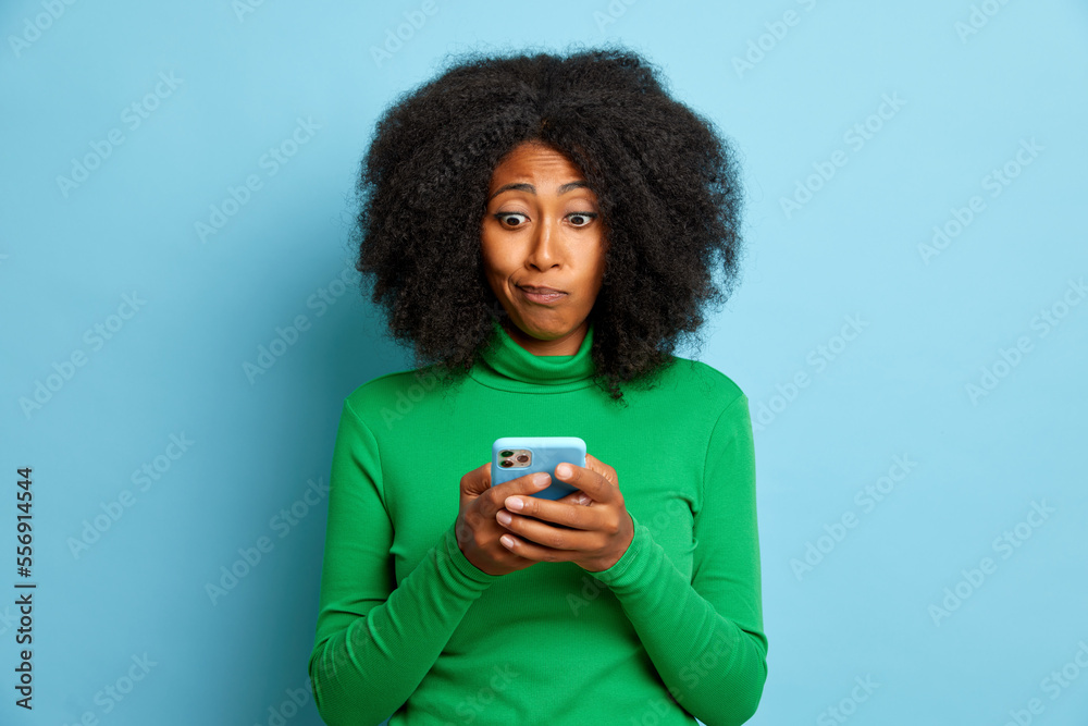 Woman chatting in smartphone, with unhappy face, isolated Woman chatting in smartphone, with unhappy face, isolated