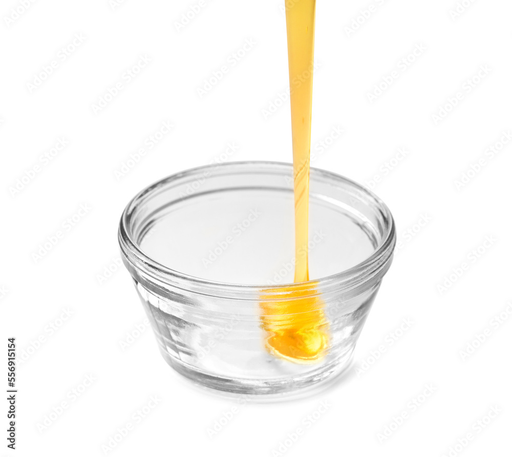 bowl of pouring honey isolated on white background bowl of pouring honey isolated on white background