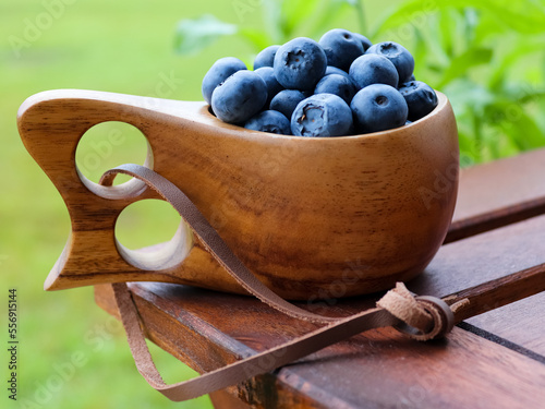 Blueberries in a wooden cup