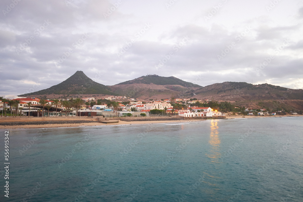 Porto Santo island, view to its highest mountain Pico do Facho and capital city Vila Baleira. Beautiful early morning, sea and beach. Porto Santo island, view to its highest mountain Pico do Facho and capital city Vila Baleira. Beautiful early morning, sea and beach.