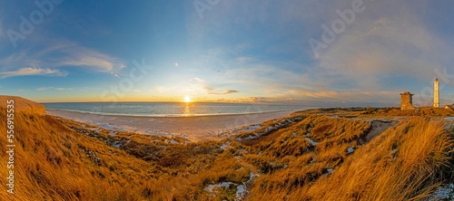 Panorama over the beach of the Danish coastal resort of Blavand at sunset