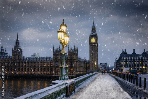Winter view of the Westminster Bridge and Big Ben clocktower in London during a winter day with ice and snow, England
