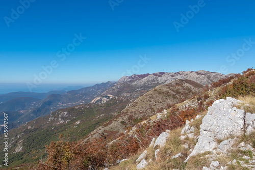 Panoramic view of the mountain chains of the Dinaric Alps seen from Goli Vrh near Budva, Montenegro, Balkan, Europe. Summits Kolozunske grade and Babina Glava. Budvanian riviera in beautiful autumn