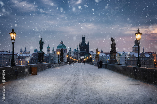 Canvas Print View over the snow covered Charles Bridge in Prague to the skyline of the old to