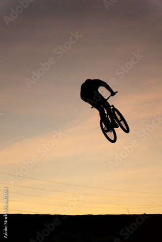 silhouette cyclist jumping