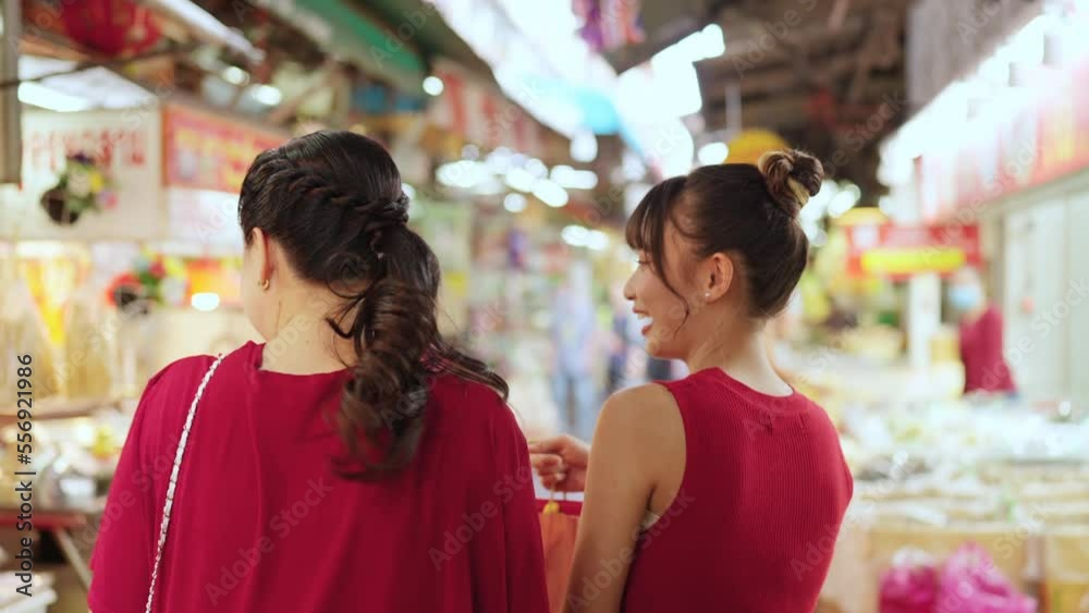4K Happy Asian family mother and daughter choosing and buying raw food and groceries for cooking celebrating Chinese Lunar New Year festive at Bangkok Chinatown street market. Chinese culture concept. 4K Happy Asian family mother and daughter choosing and buying raw food and groceries for cooking celebrating Chinese Lunar New Year festive at Bangkok Chinatown street market. Chinese culture concept.