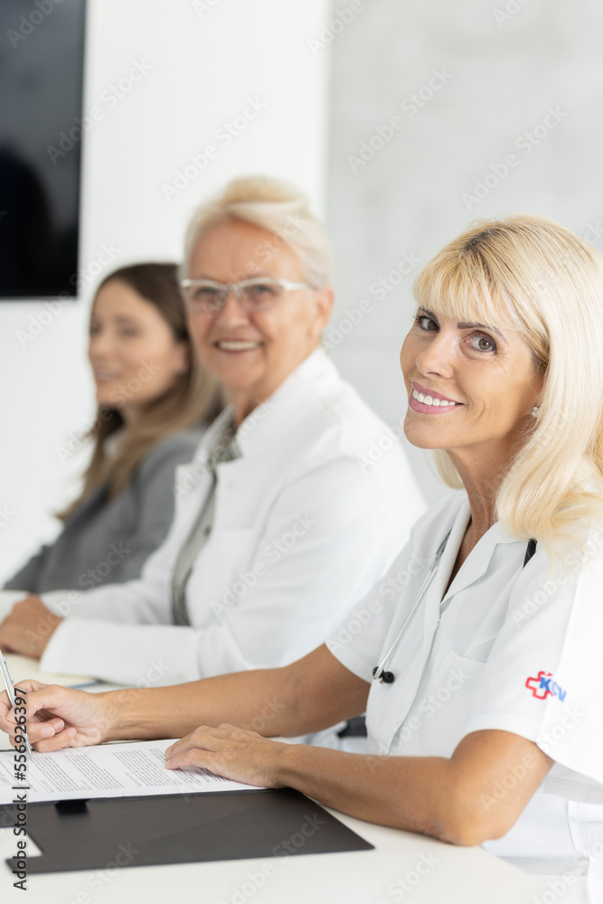 Team of doctors on a meeting, discussing some new trends in medical work Team of doctors on a meeting, discussing some new trends in medical work