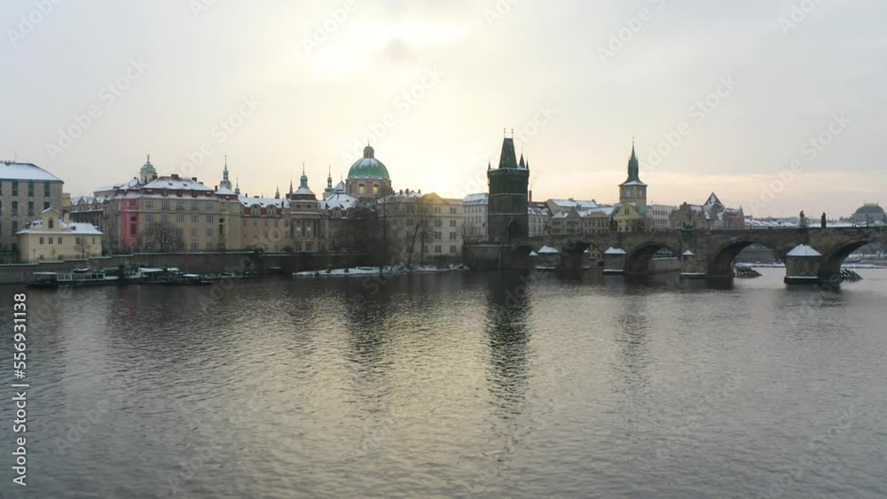 Cinematic Establishing Shot of Prague Old Town in Winter. Drone Flies Over River, Charles Bridge Cinematic Establishing Shot of Prague Old Town in Winter. Drone Flies Over River, Charles Bridge