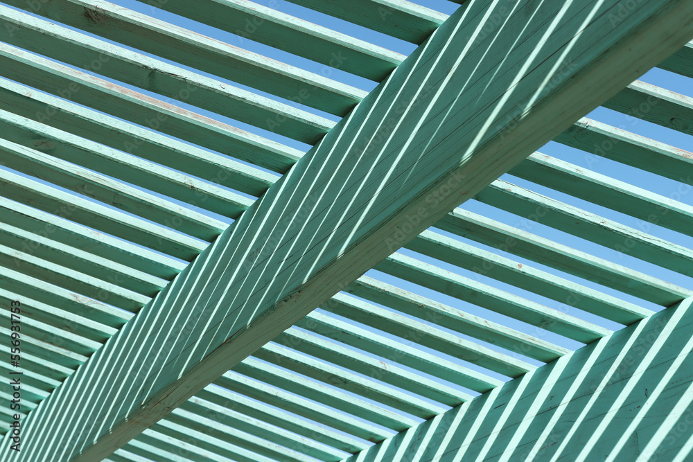 Wooden strips create abstract figures. light and shadow Wooden strips create abstract figures. light and shadow