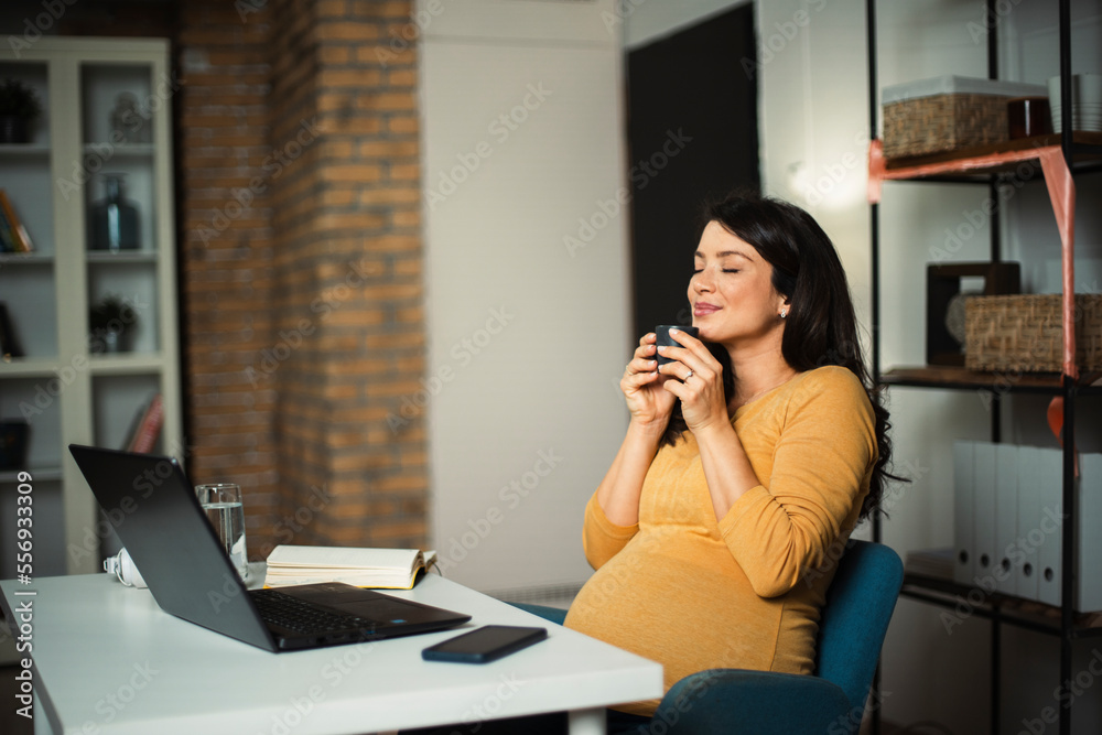 Pregnant woman in office. Beautiful businesswoman enjoy in fresh coffee. Pregnant woman in office. Beautiful businesswoman enjoy in fresh coffee.