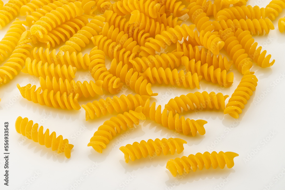 Dry uncooked italian fusilli pasta, macaroni isolated on white top view Dry uncooked italian fusilli pasta, macaroni isolated on white top view