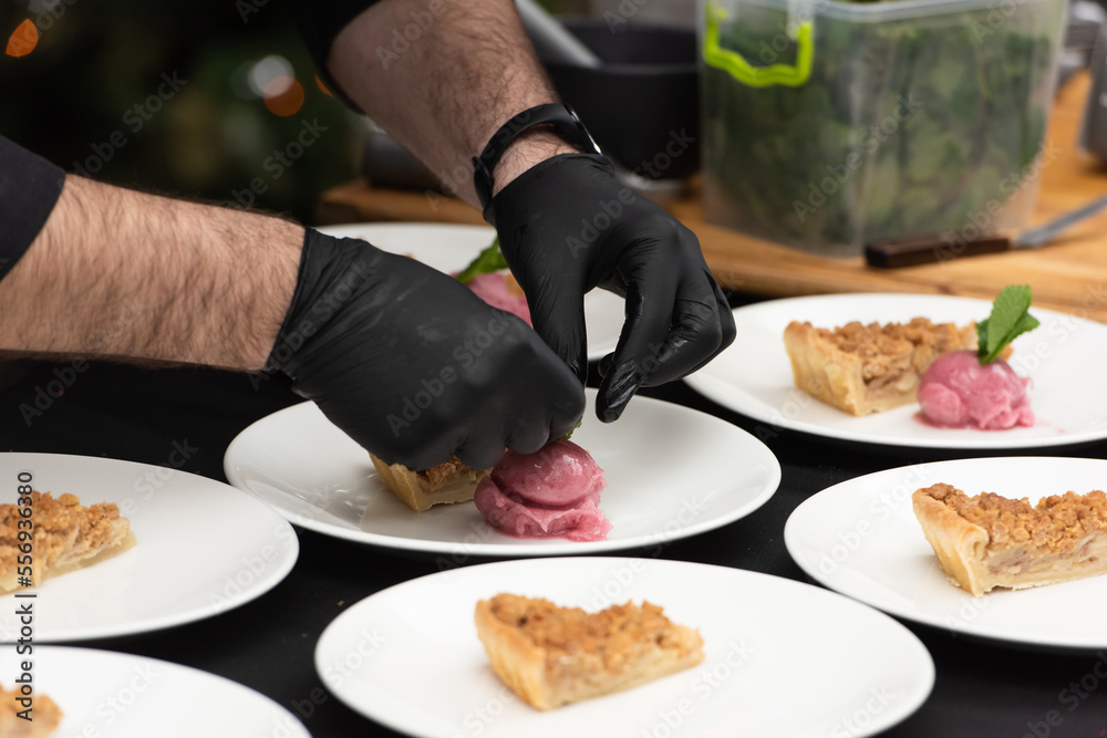 chief serving slice of apple pie and sorbet chief serving slice of apple pie and sorbet