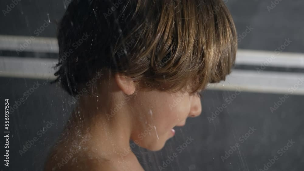 one-cute-little-boy-entering-shower-in-slow-motion-showering-child