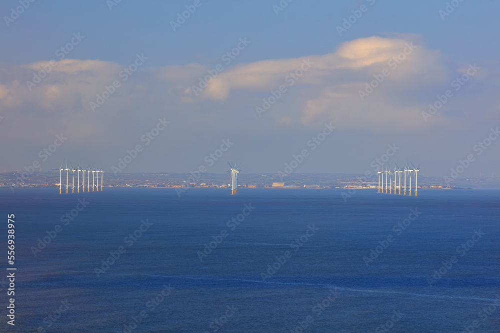 Distant view of a offshore wind farm off the coast of teeside, North east England, UK.