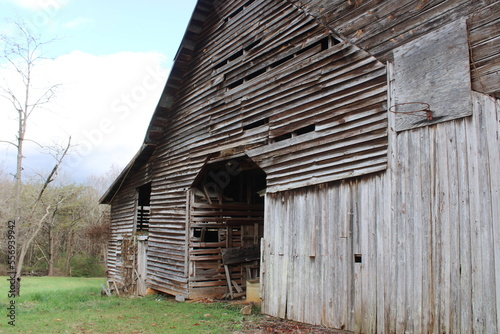 old wooden barn with basketball hoop