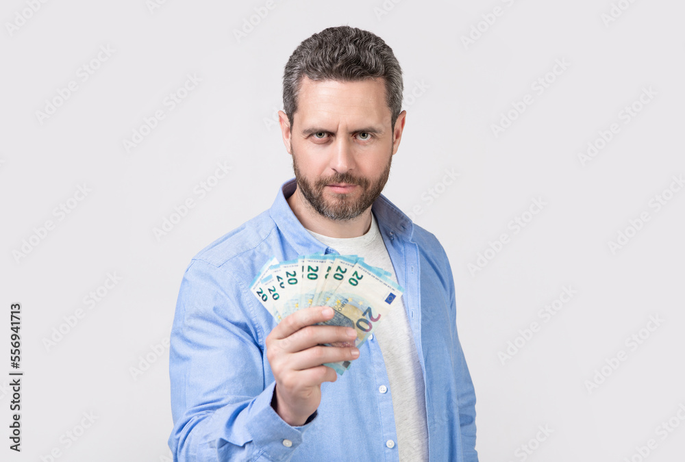 photo of man with salary money. man with salary money isolated on studio background. photo of man with salary money. man with salary money isolated on studio background.